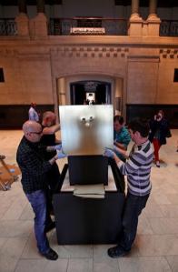 The artist installing his work, "Crown," at Cincinnati Art Museum. Photo by The Enquirer/Glenn Hartong
