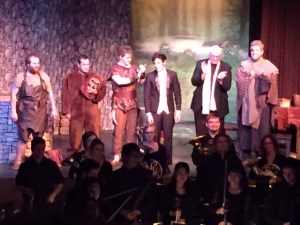 The cast, with conductor Isaac Selya and director James Slouffman, center